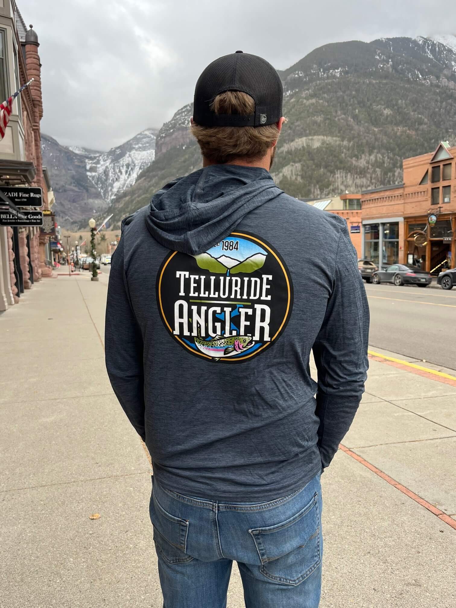 https://tellurideangler.com/wp-content/uploads/2023/11/Patagonia-Mens-Cap-Cool-Daily-Hoody-Smolder-Blue-back-rotated.jpg